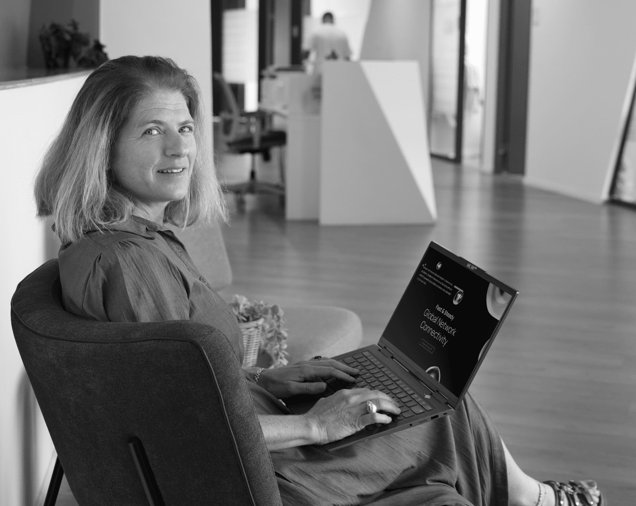 Woman with Laptop using Teridion Global Network