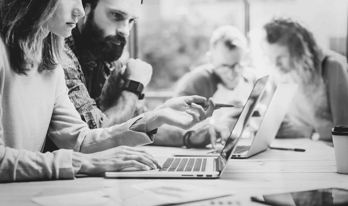 SD-WAN Vs VPN featured image of two people focused on laptop